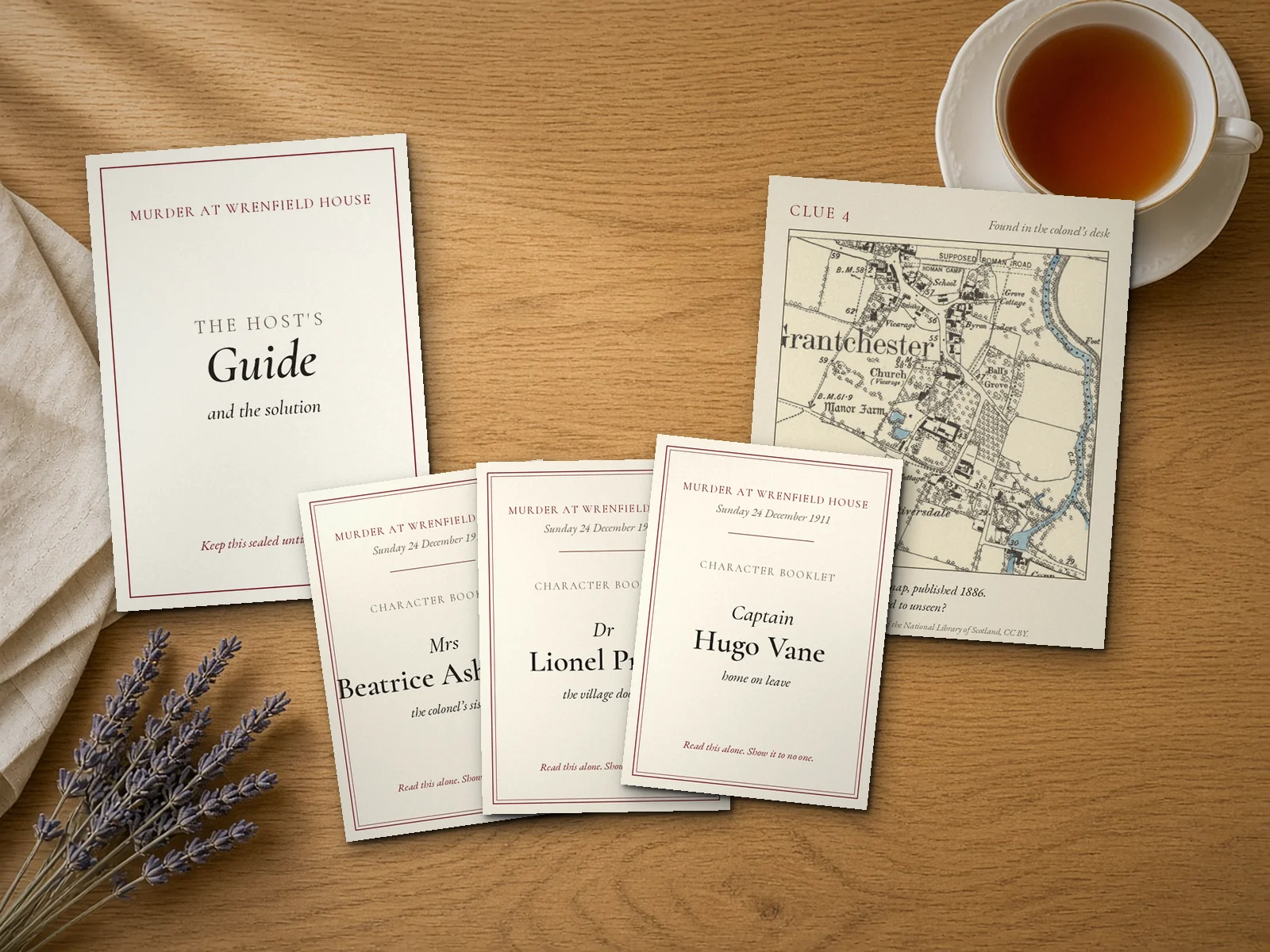 Styled example of Murder at Your House as printed at home on plain paper: a host guide, three character booklets and a clue on the 1886 Ordnance Survey map, for Murder at Wrenfield House, Christmas Eve 1911 (a fictional house and characters), laid out on a table